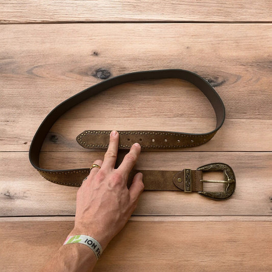 Vintage style faux leather western cowboy gothic belt in brown with brass trim.