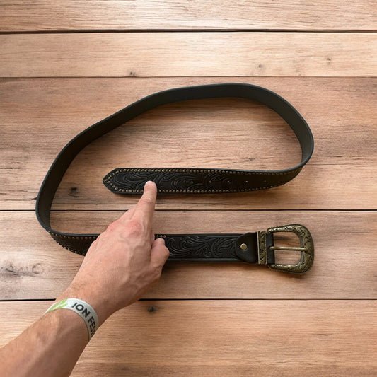 Vintage style faux leather western cowboy gothic belt in black with brass trim.