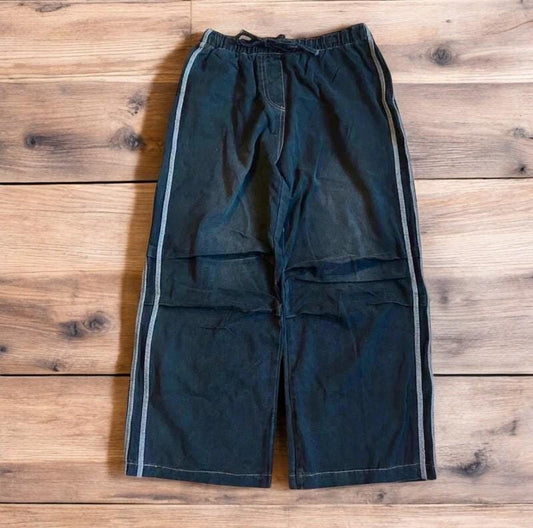 Vintage style baggy wide leg skater fit jeans with side stripes in washed black.