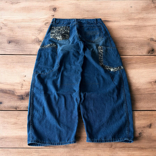 Incredible vintage style baggy wide leg skater fit jeans with leopard print in mid blue.