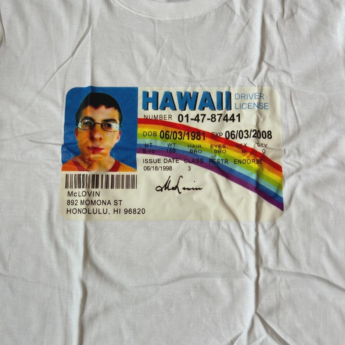 Novelty Superbad Mclovin I.D. T-shirt with front graphic print in white.