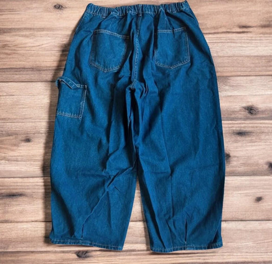 Vintage style baggy wide leg skater fit jeans in washed mid blue.