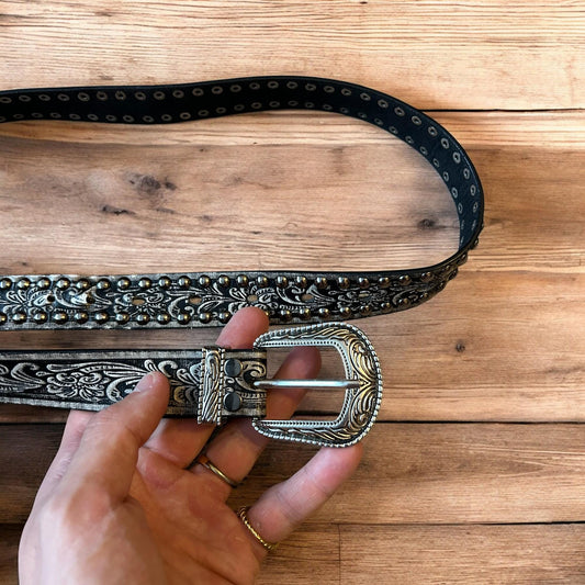 Vintage style faux leather western cowboy gothic belt in black with silver trim.