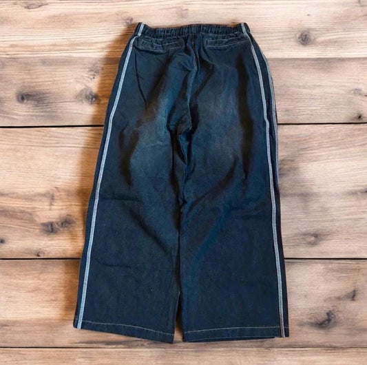 Vintage style baggy wide leg skater fit jeans with side stripes in washed black.