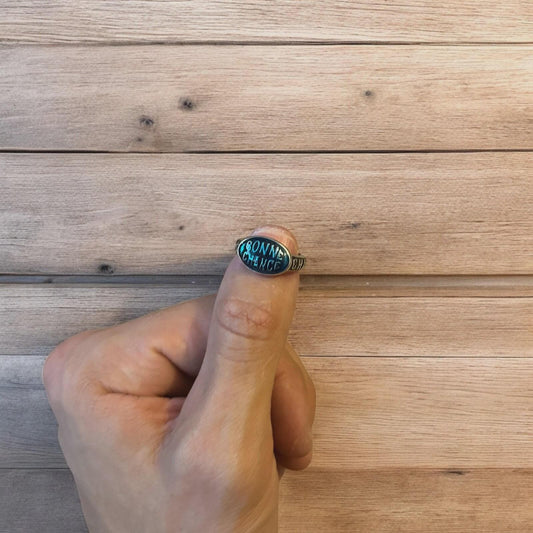 Vintage style stainless steel Bonne Chance ring in silver/ blue. One size.