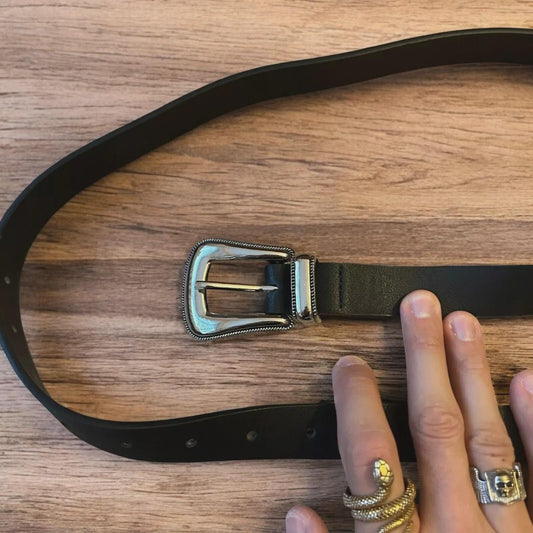 Vintage style faux leather western cowboy belt in black with silver trim. 100cm.