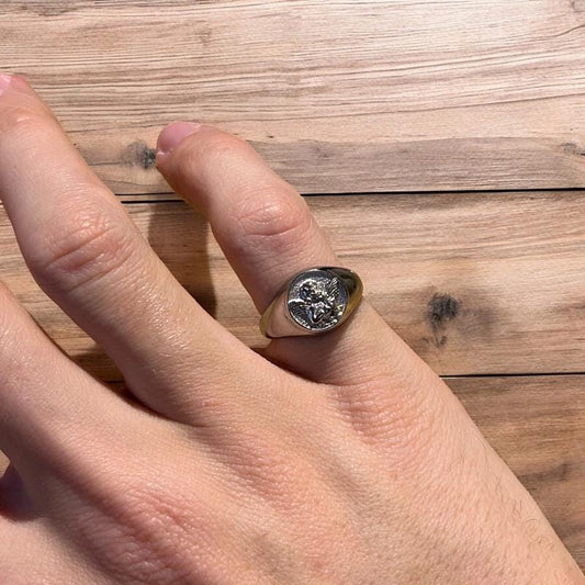 Lovely vintage style stainless steel angel signet ring in silver.