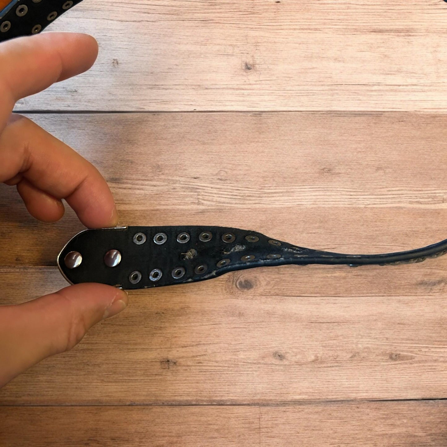 Vintage style faux leather western cowboy gothic belt in black with silver trim.