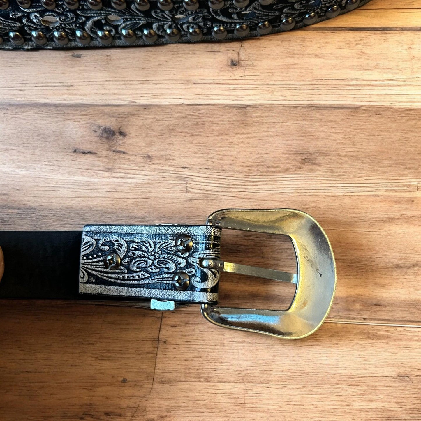 Vintage style faux leather western cowboy gothic belt in black with silver trim.