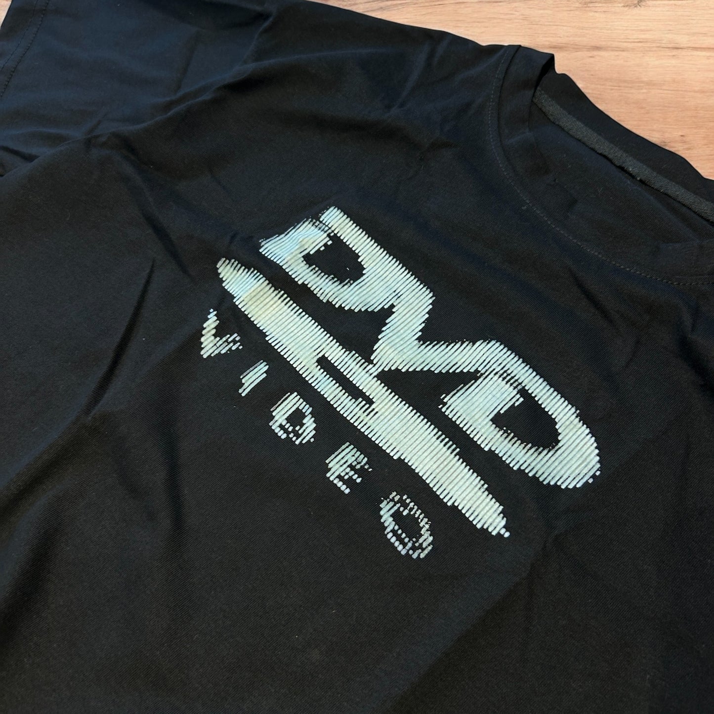 Vintage style old school DVD Video T-shirt with front graphic in black.