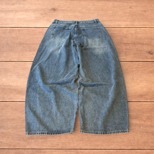 Vintage skater style baggy wide leg fit jeans with fade in mid blue.