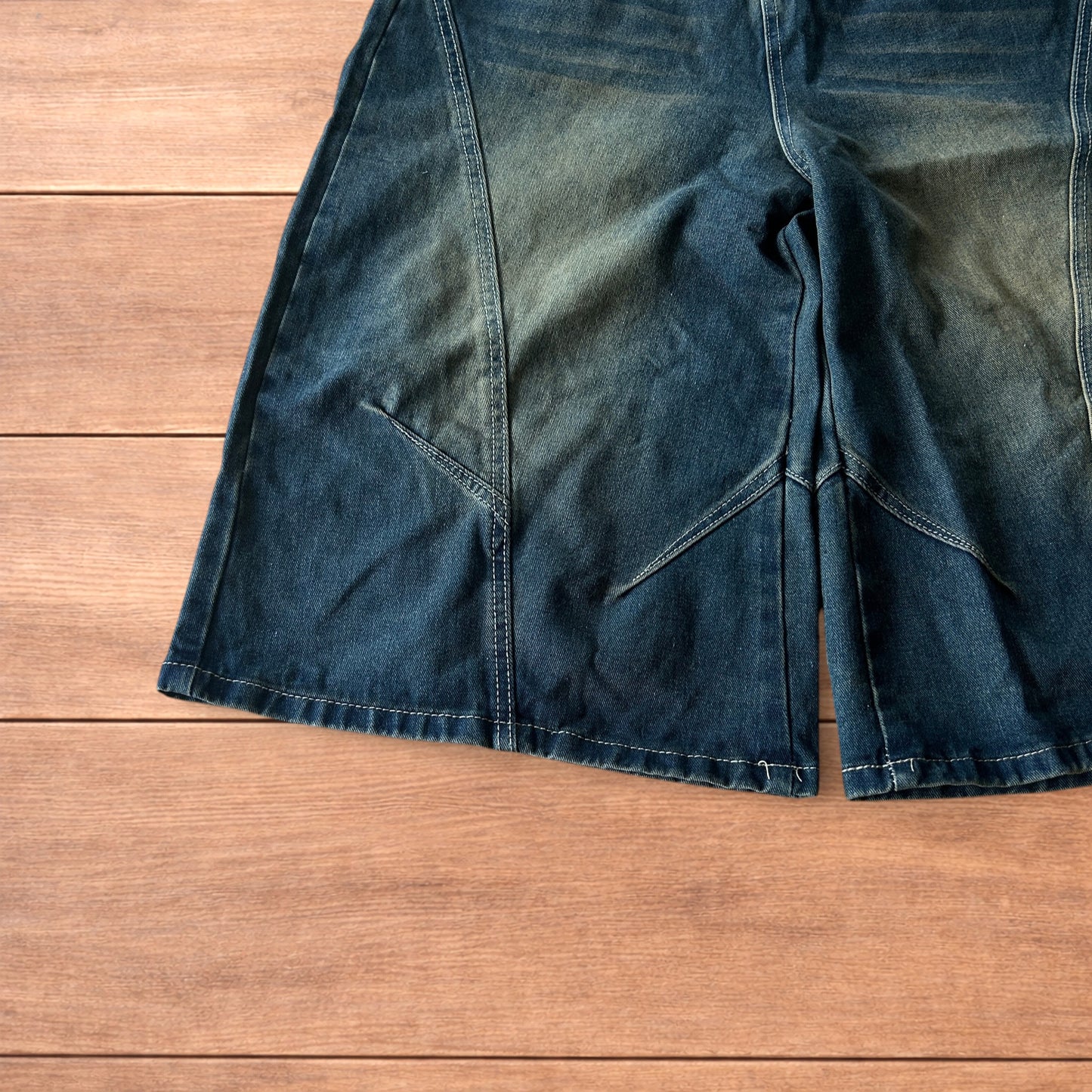Super baggy wide leg denim carpenter shorts jorts in dark blue wash.
