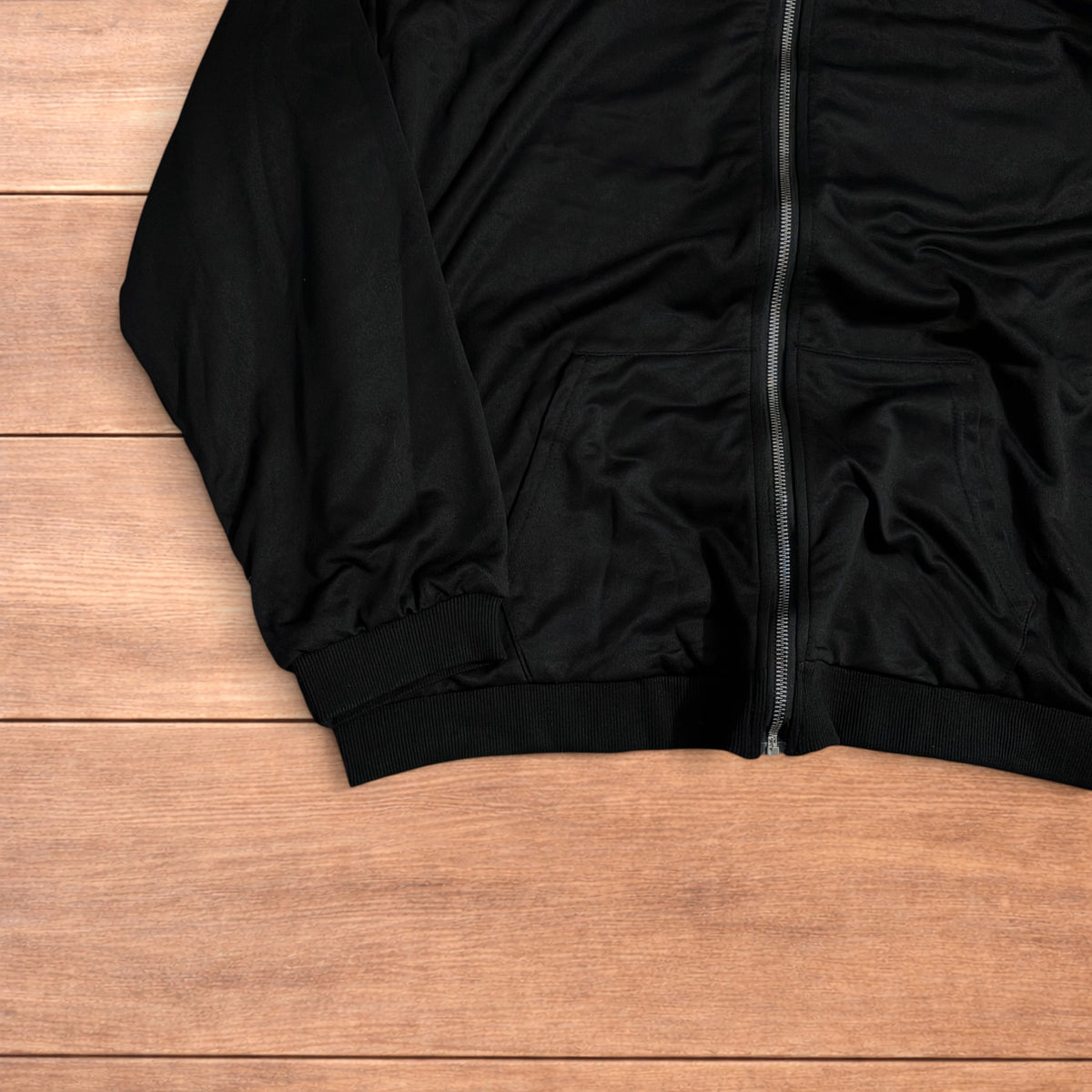 Oversized baggy reversible zip up hoodie jumper laid flat showing grey camo print and black hood lining