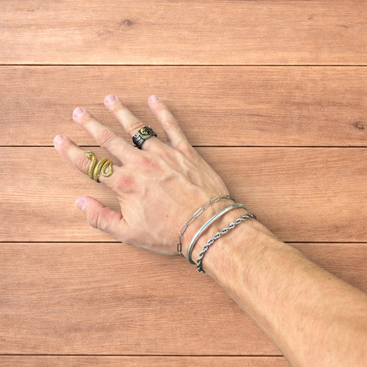 Trio of stainless steel bracelets in silver.
