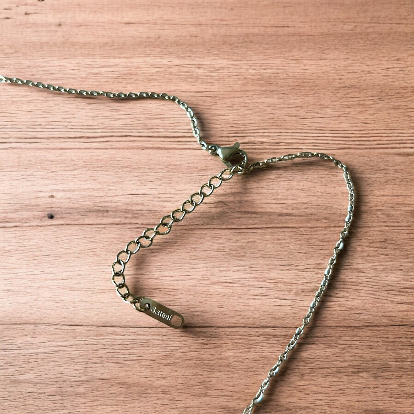 Lovely Gold stainless steel necklace of female woman figure silhouette body.