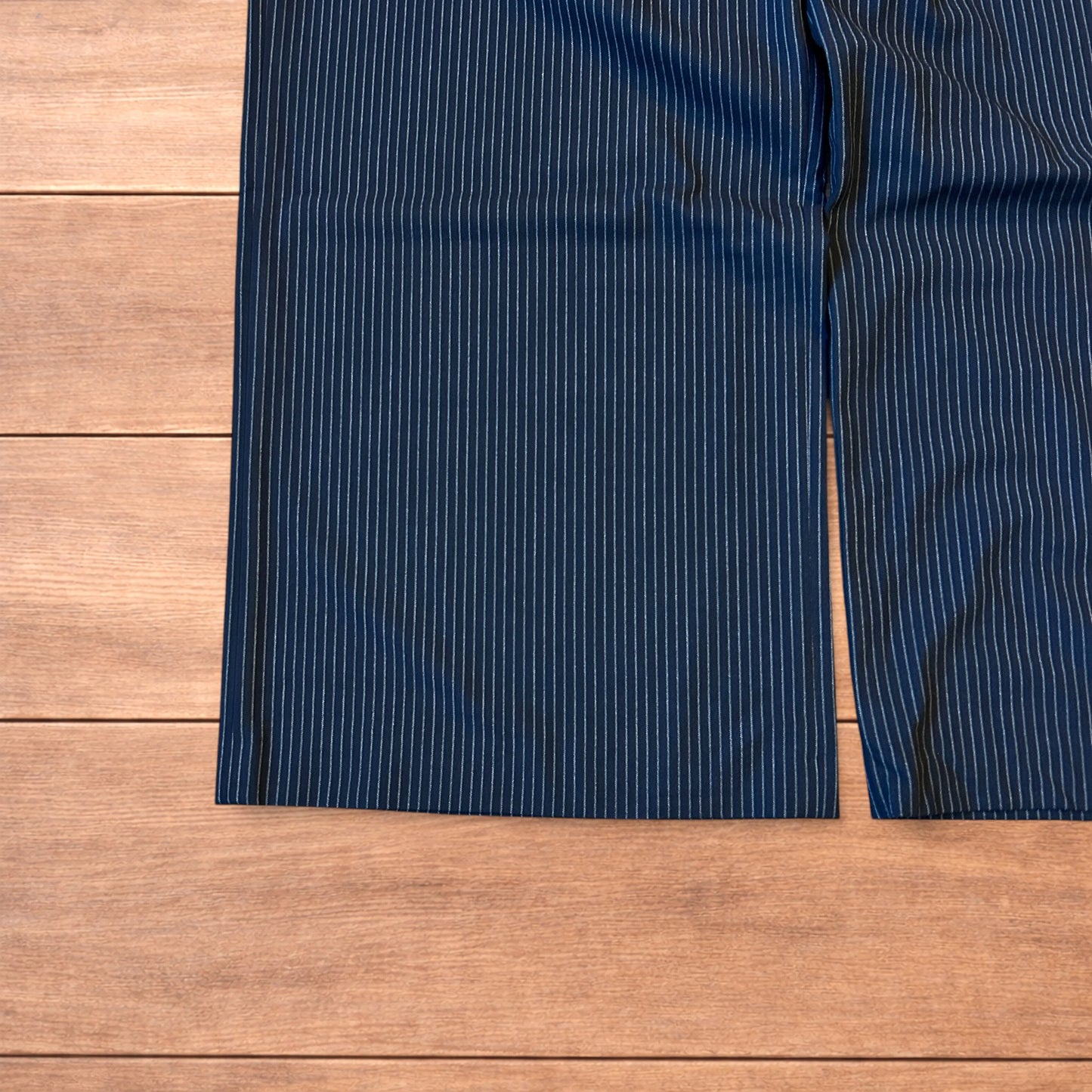 Vintage style baggy wide leg pinstripe tailored trousers in navy blue.