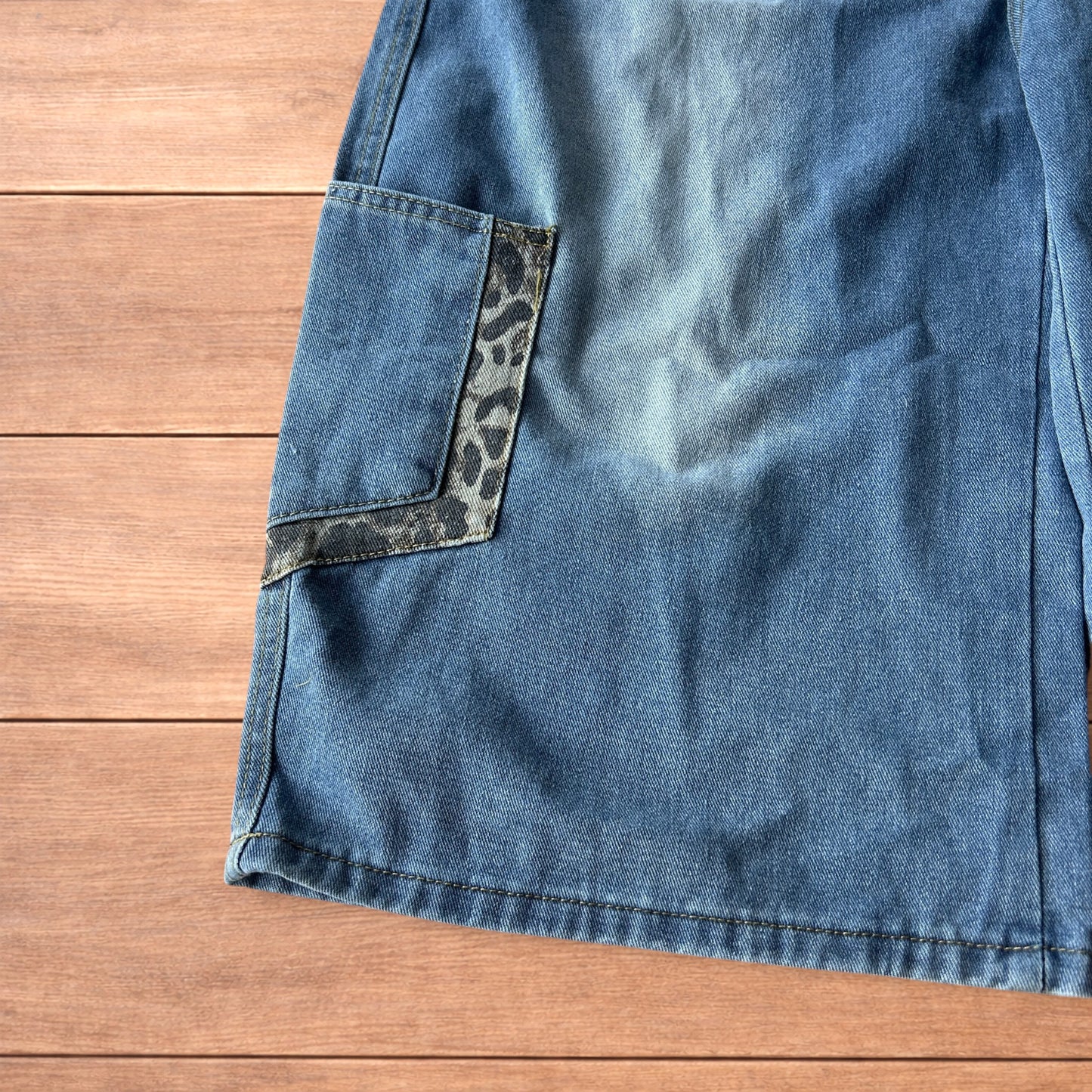 Vintage style baggy wide leg skater fit jorts shorts with leopard print in mid blue.