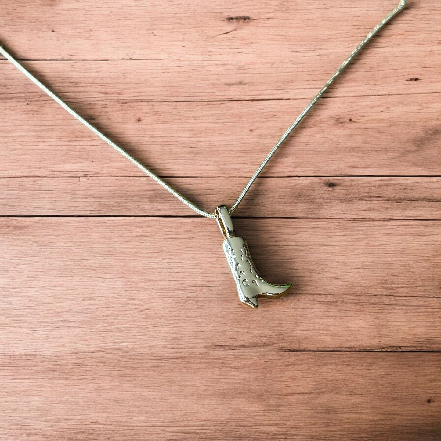 Lovely stainless steel necklace of cowboy cowgirl western boot in gold.