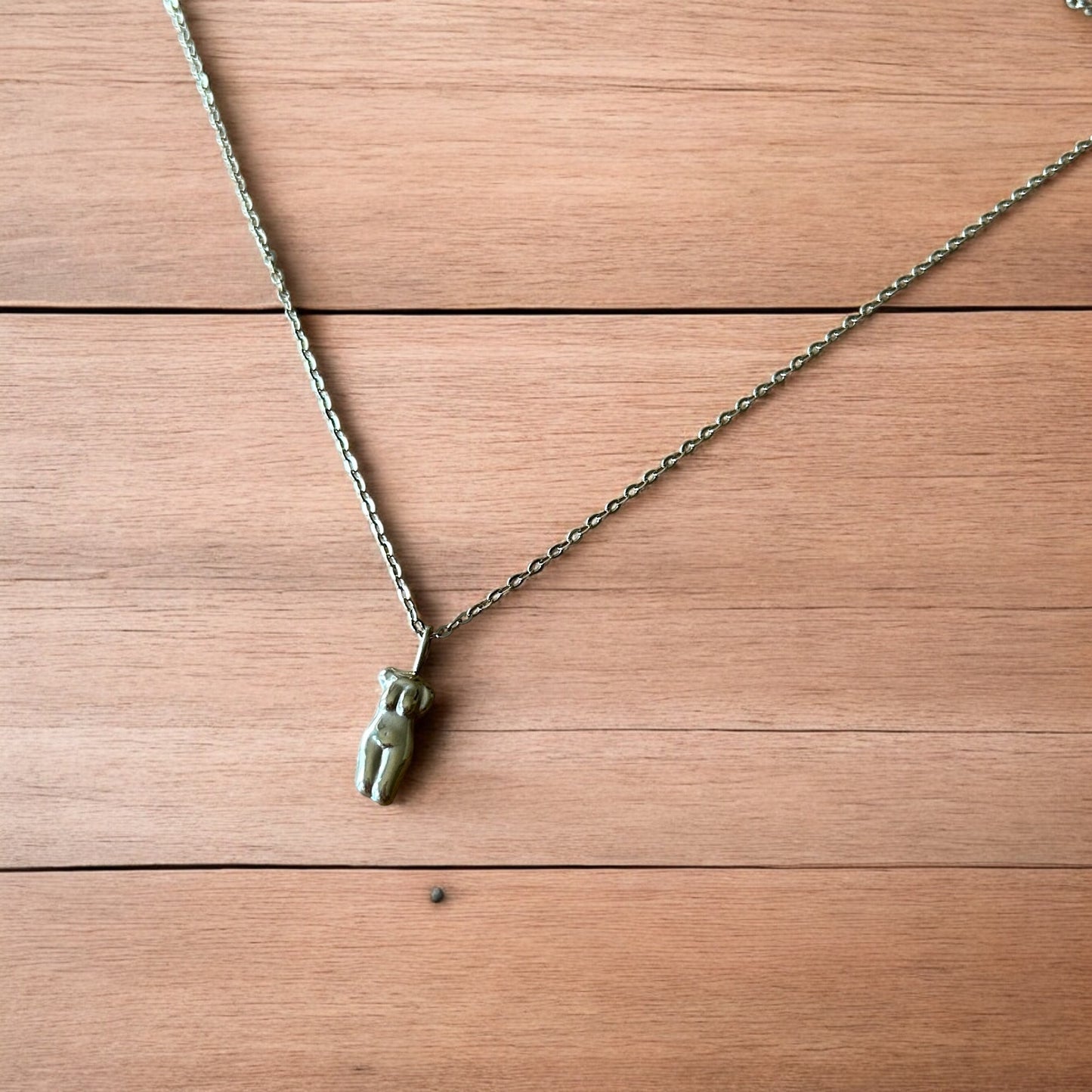 Lovely Gold stainless steel necklace of female woman figure silhouette body.