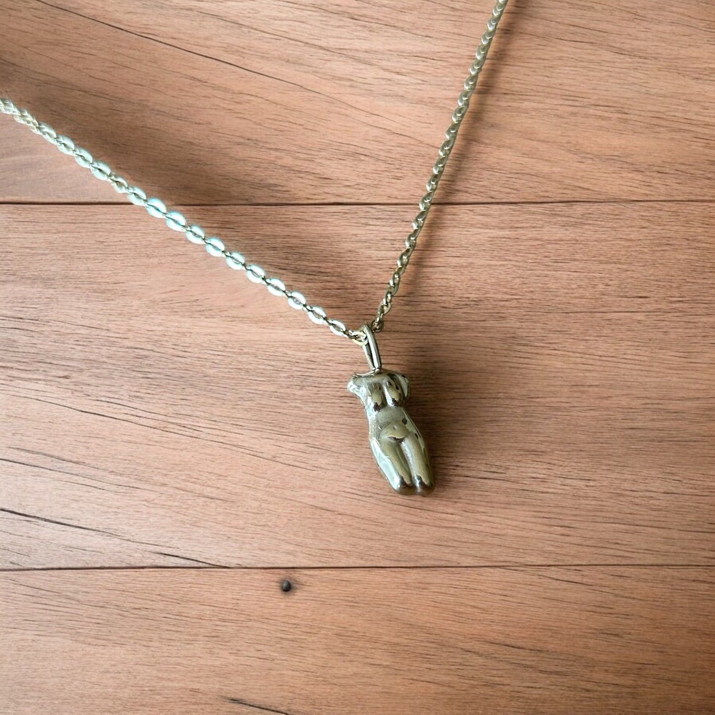 Lovely Gold stainless steel necklace of female woman figure silhouette body.