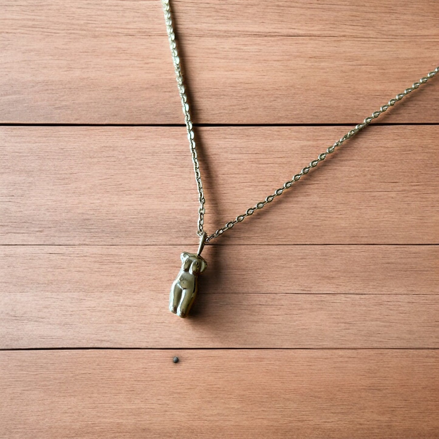 Lovely Gold stainless steel necklace of female woman figure silhouette body.