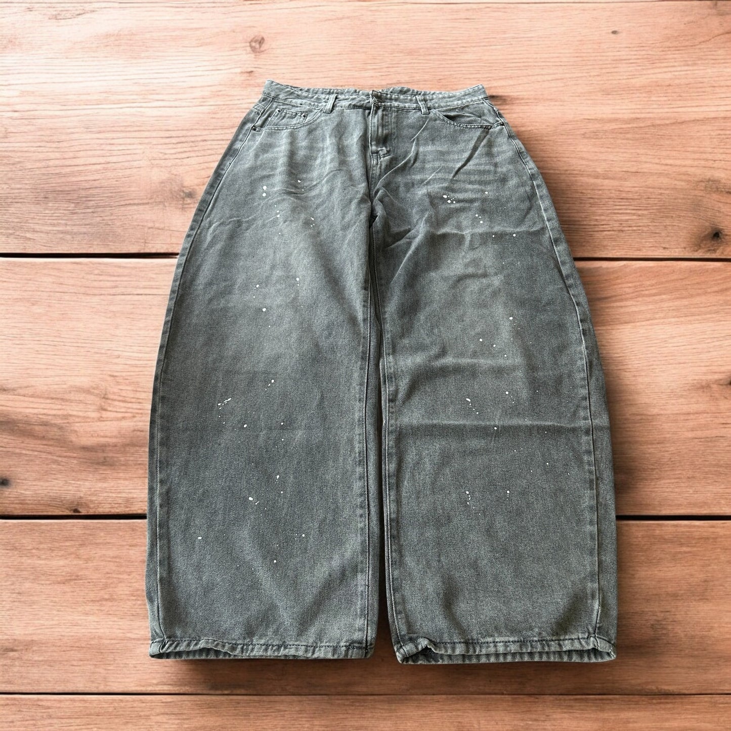 Vintage style baggy wide leg skater fit jeans in grey with paint splatters.