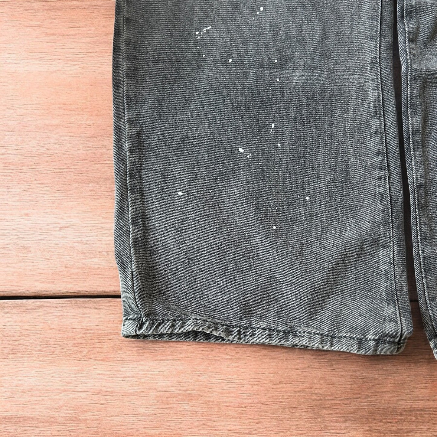 Vintage style baggy wide leg skater fit jeans in grey with paint splatters.