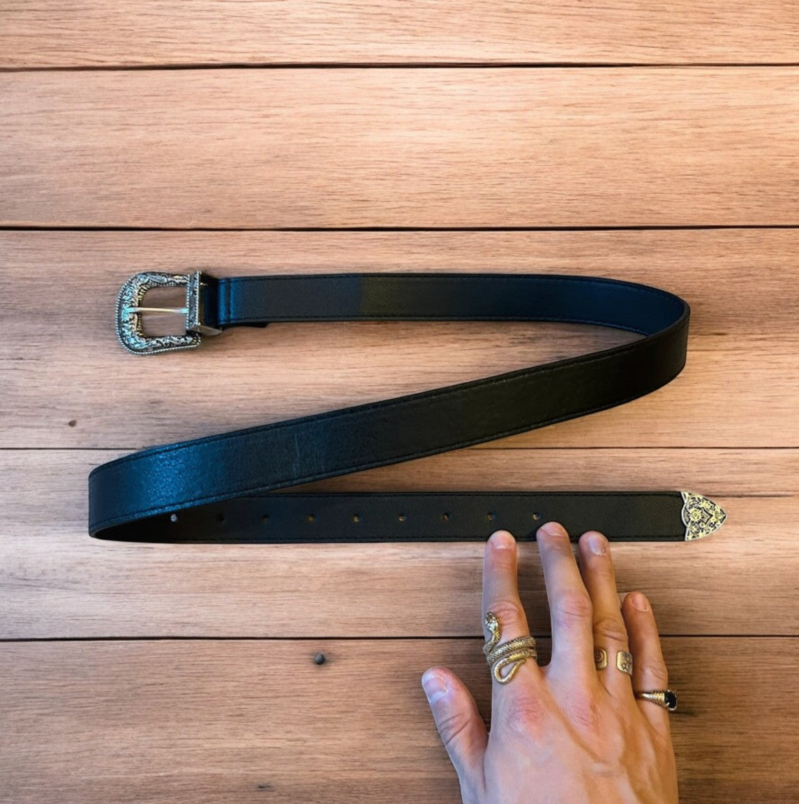 Vintage style faux leather western cowboy belt in black with silver trim. 105cm.