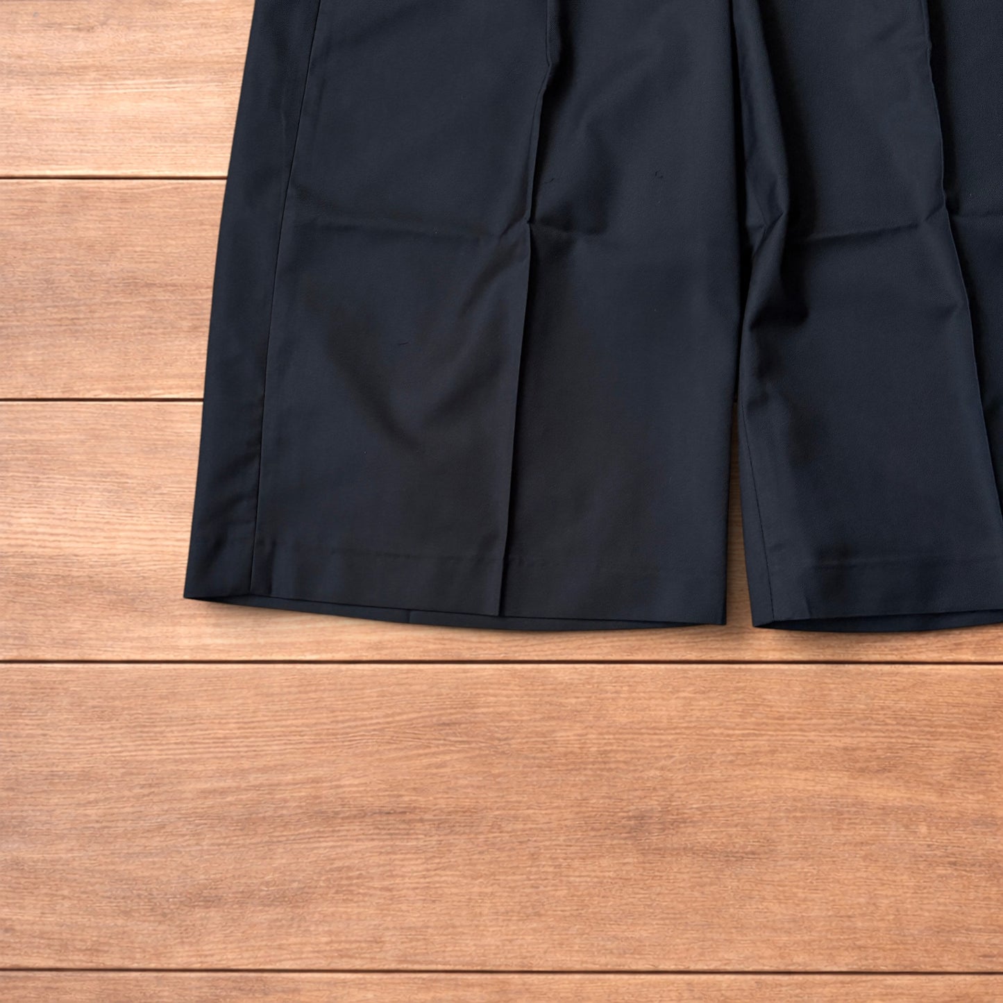 Vintage style baggy wide leg long tailored shorts in black.