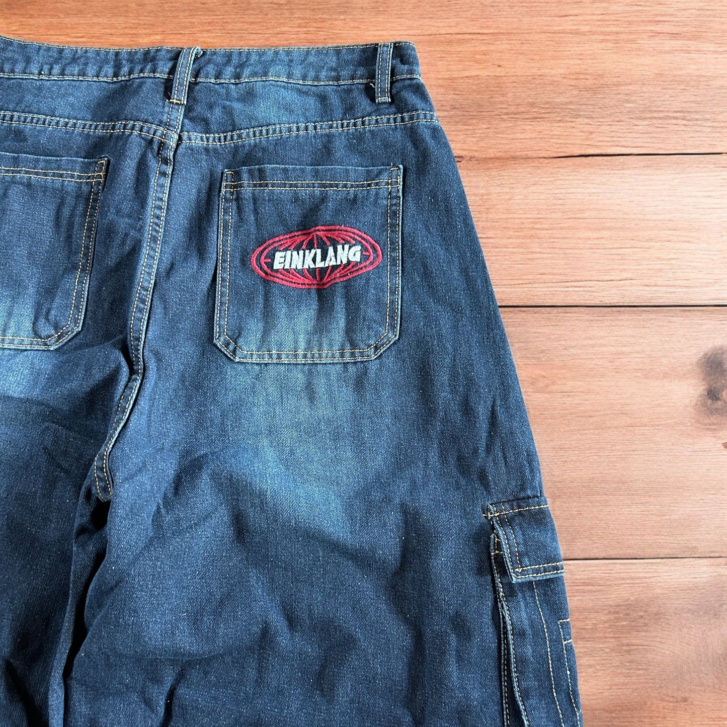 Incredible vintage style baggy wide leg skater fit cargo jeans with embroidery in mid blue.