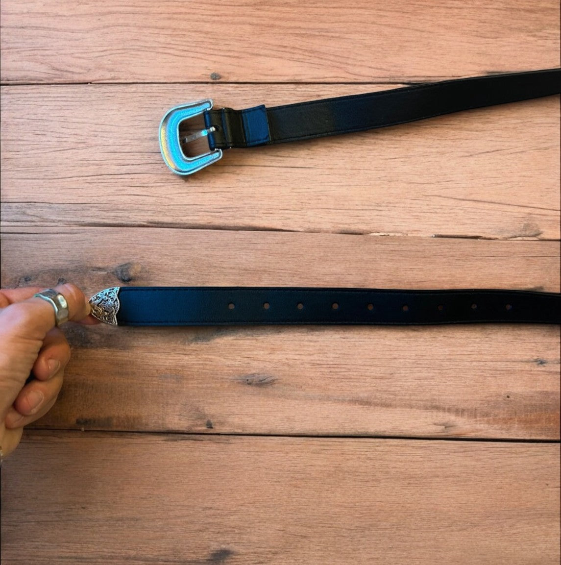 Vintage style faux leather western cowboy belt in black with silver trim. 105cm.