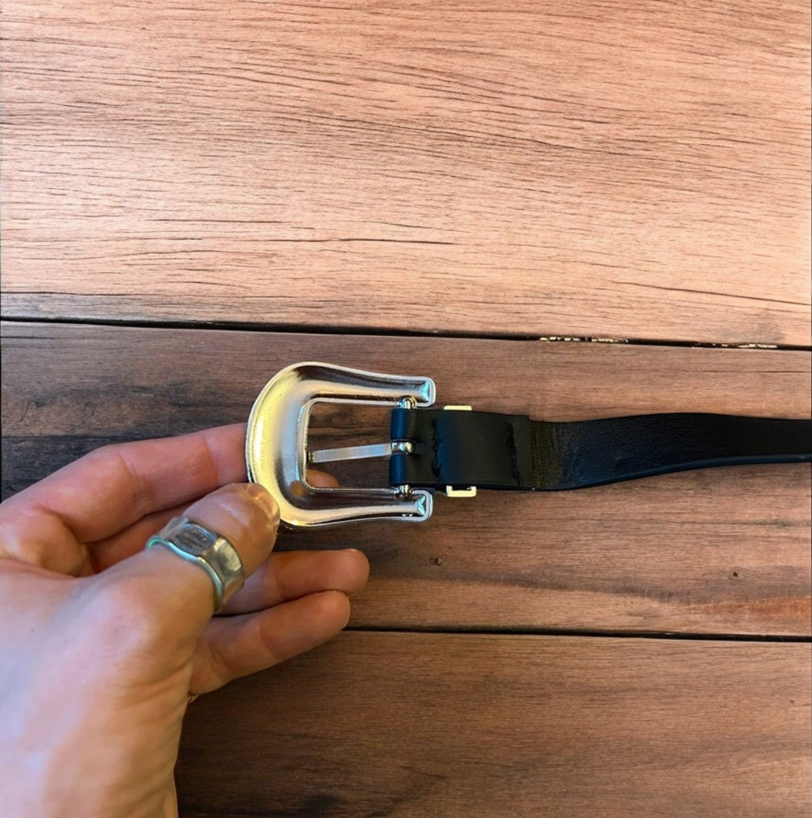 Vintage style faux leather western cowboy belt in black with silver trim. 100cm.