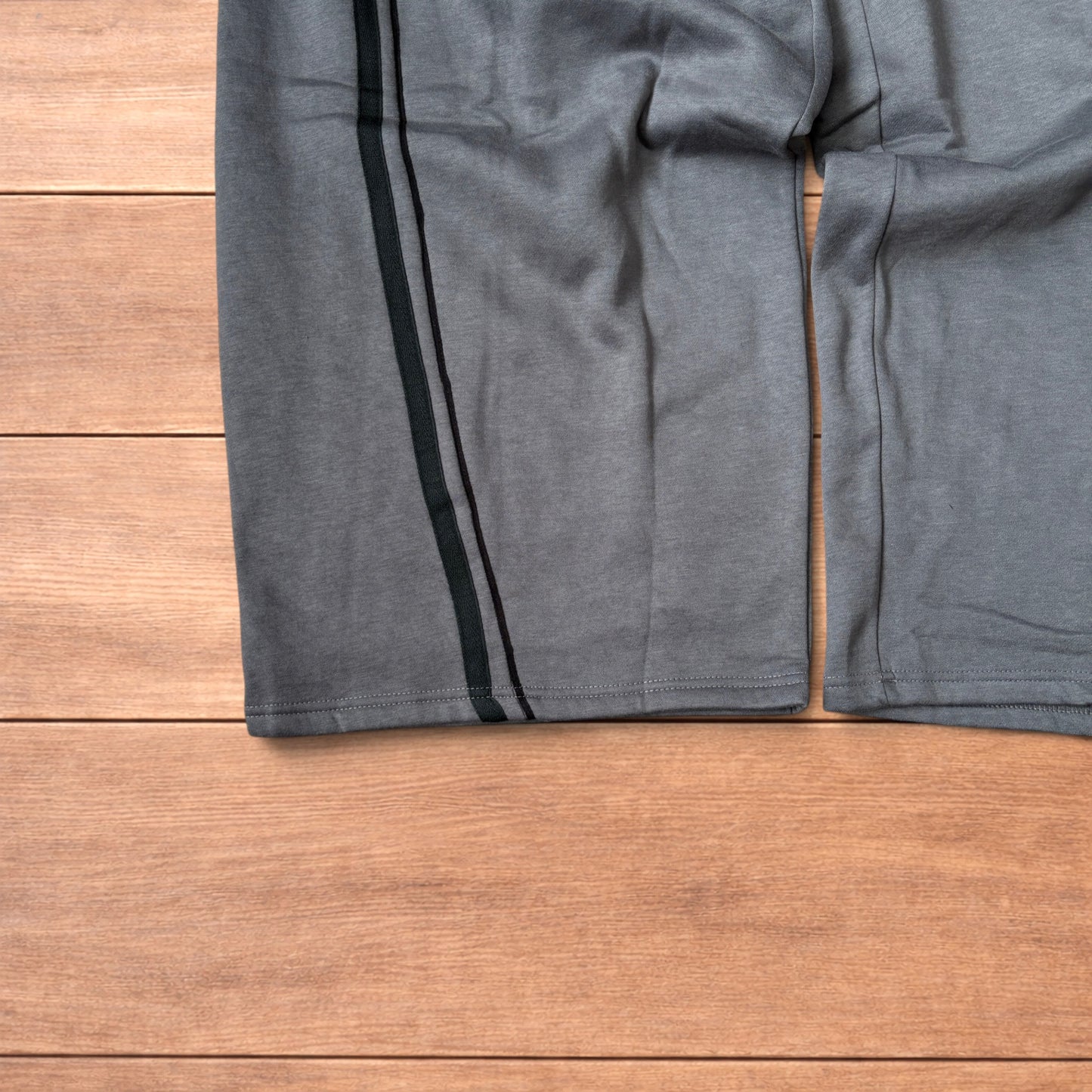 Super baggy wide leg Korean joggers with side stripes in dark grey.
