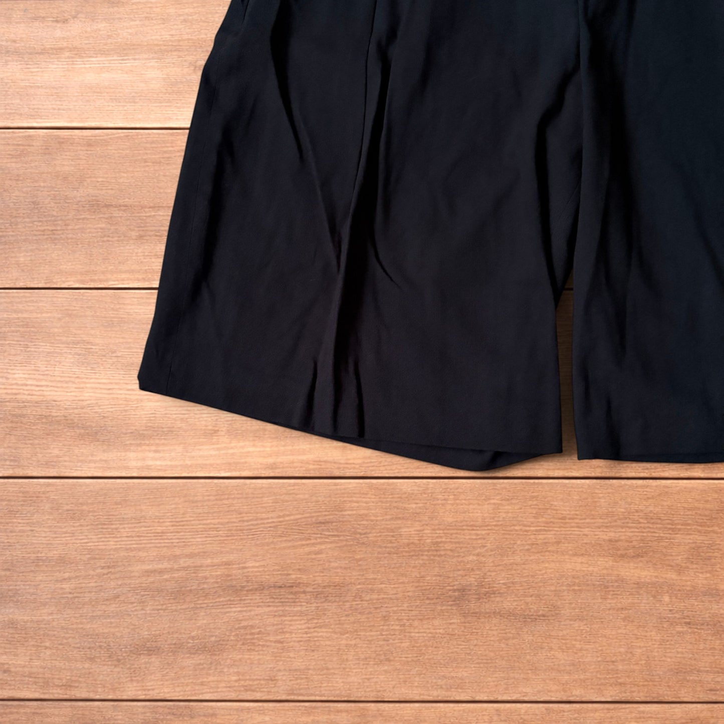 Super baggy wide tailored pleated linen shorts jorts in black.