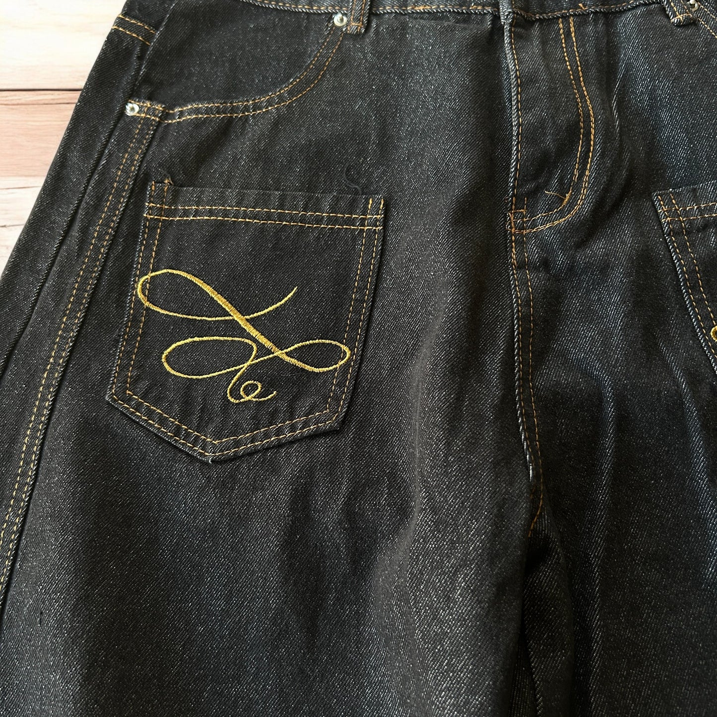 Vintage style baggy wide leg Korean fit jeans with embroidery in black.