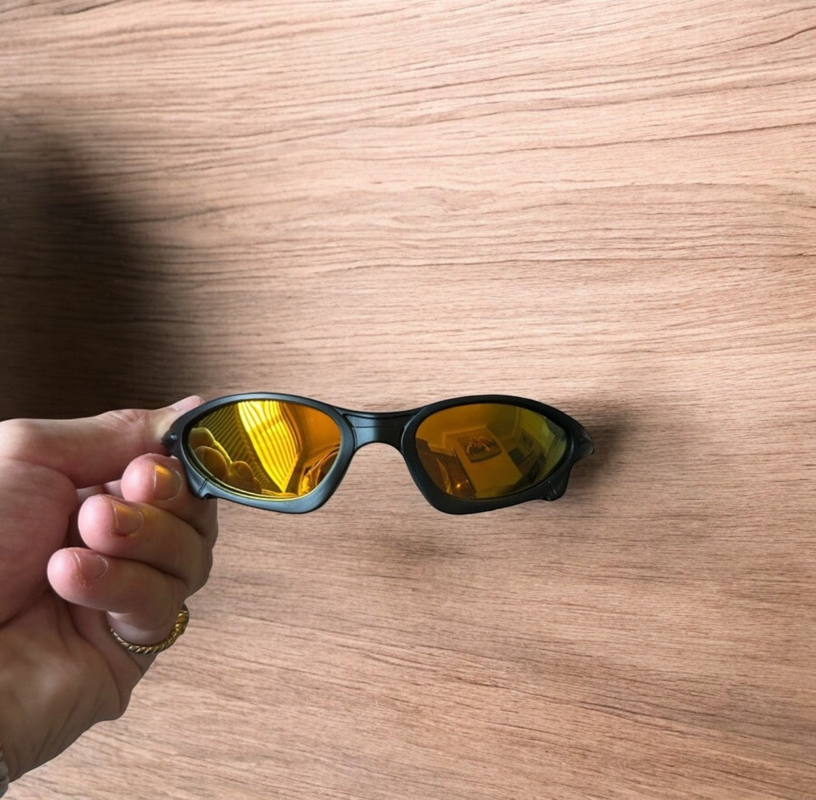 Insane polarised sunglasses in black with orange reflective lense. One size.