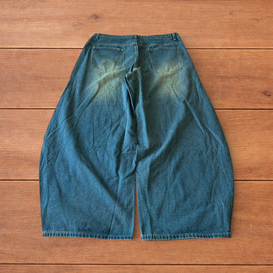 Vintage style baggy wide leg skater fit jeans with green fade in dark blue.