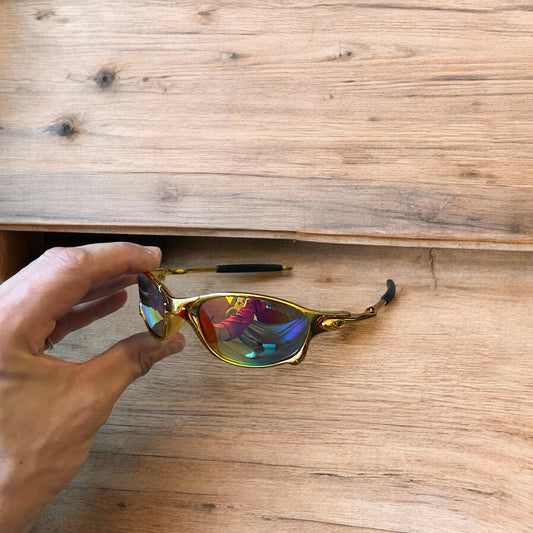 Insane metal frame sunglasses in gold with multicolour rainbow lense. One size.