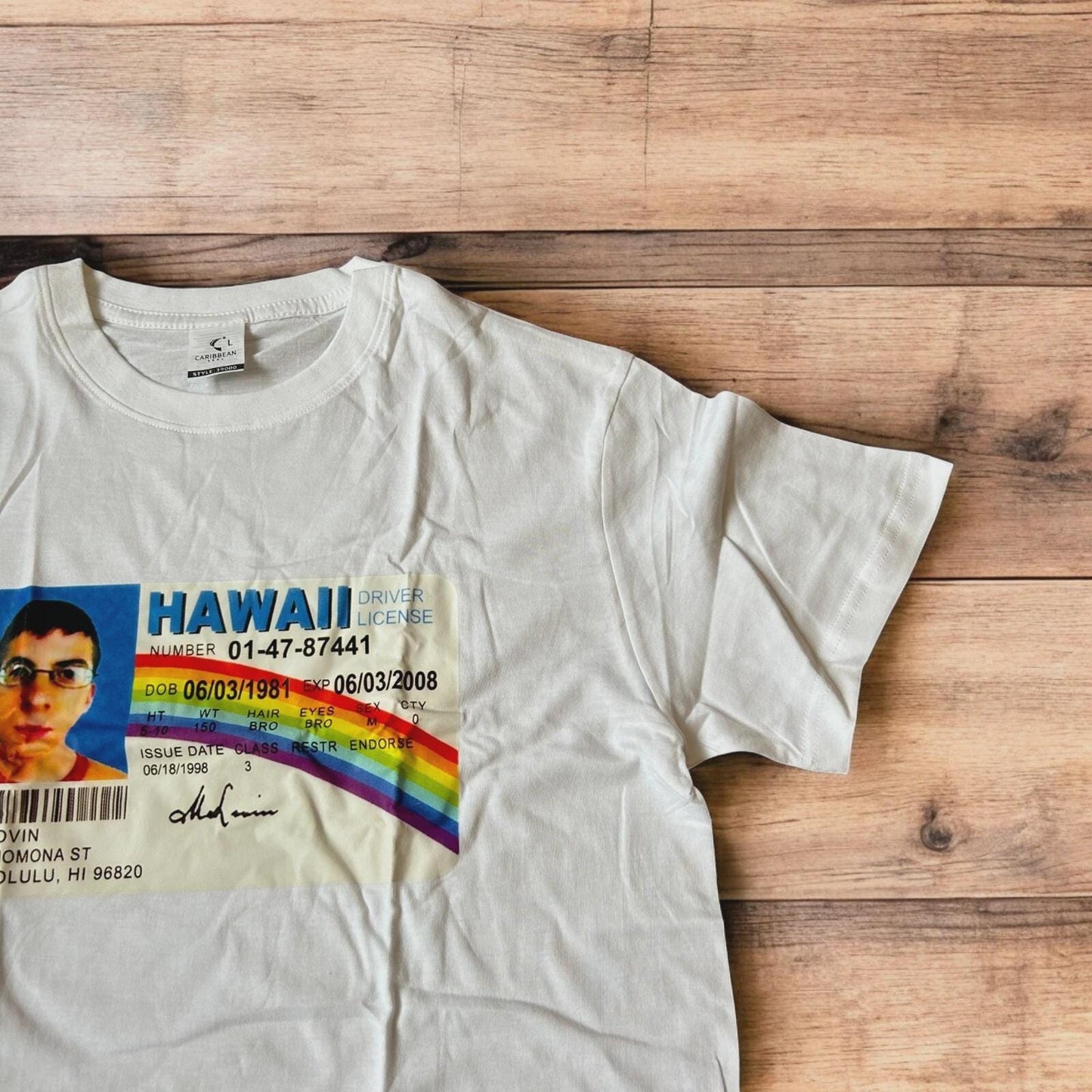 Novelty Superbad Mclovin I.D. T-shirt with front graphic print in white.