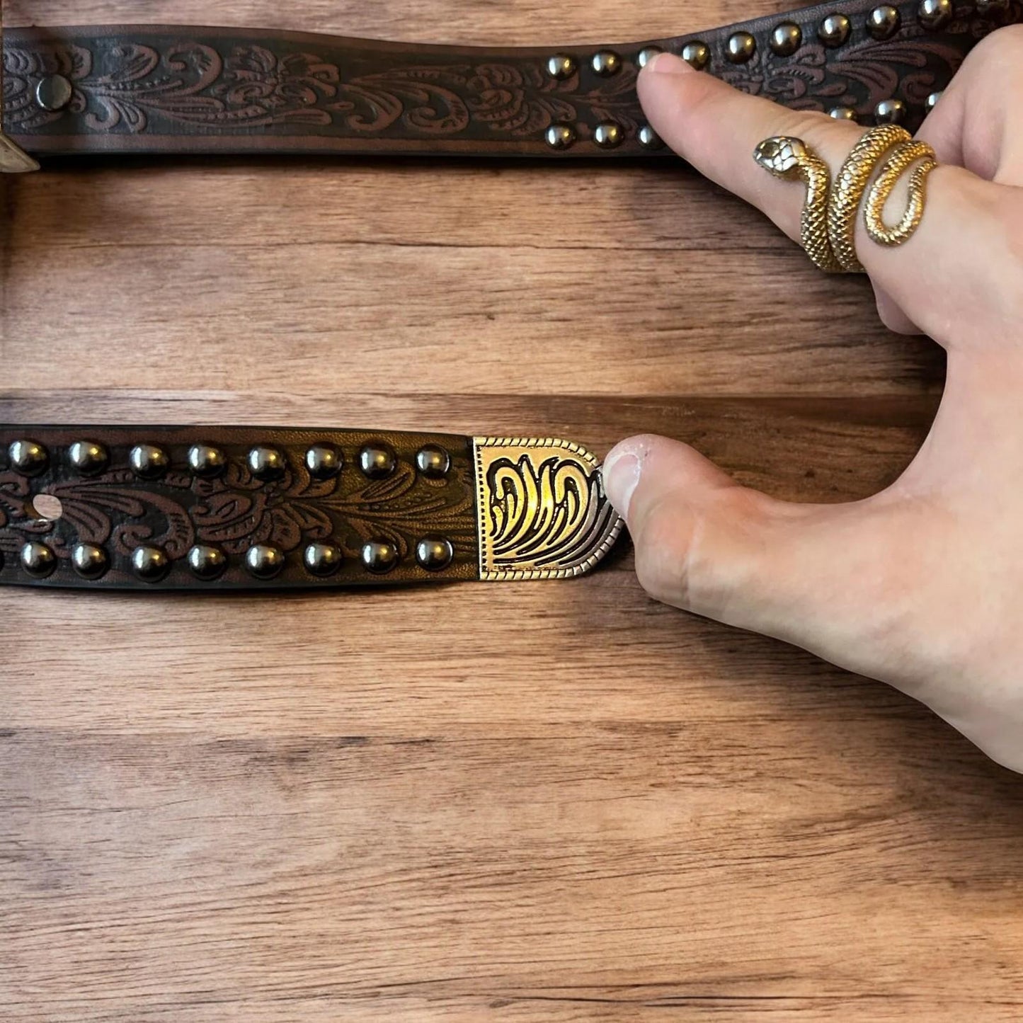 Vintage style faux leather western cowboy gothic belt in brown with silver trim.