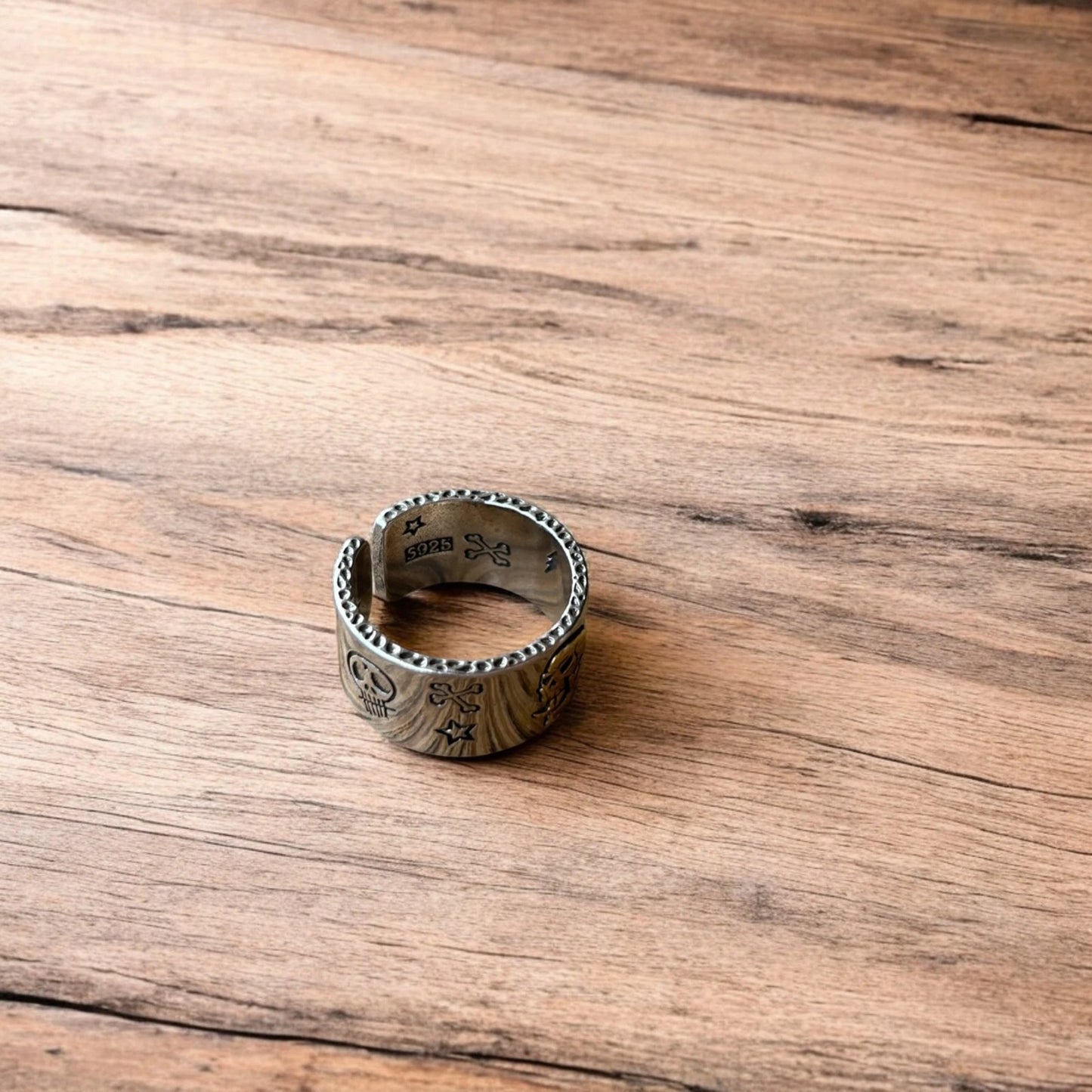 Stainless steel gothic skater skull ring in silver with gold accent. One size.