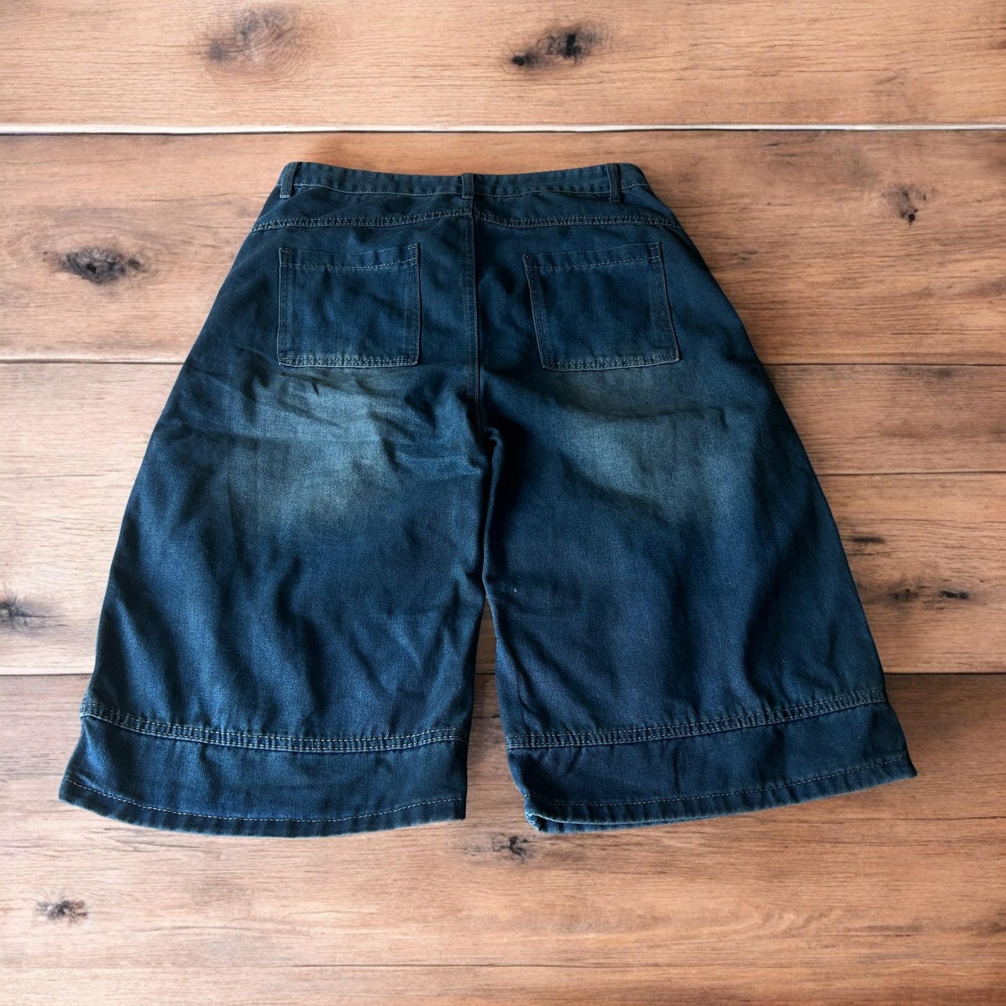 Incredible super baggy wide leg denim carpenter shorts jorts in dark blue wash.