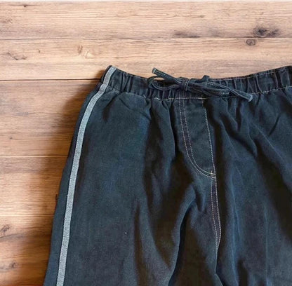 Vintage style baggy wide leg skater fit jeans with side stripes in washed black.
