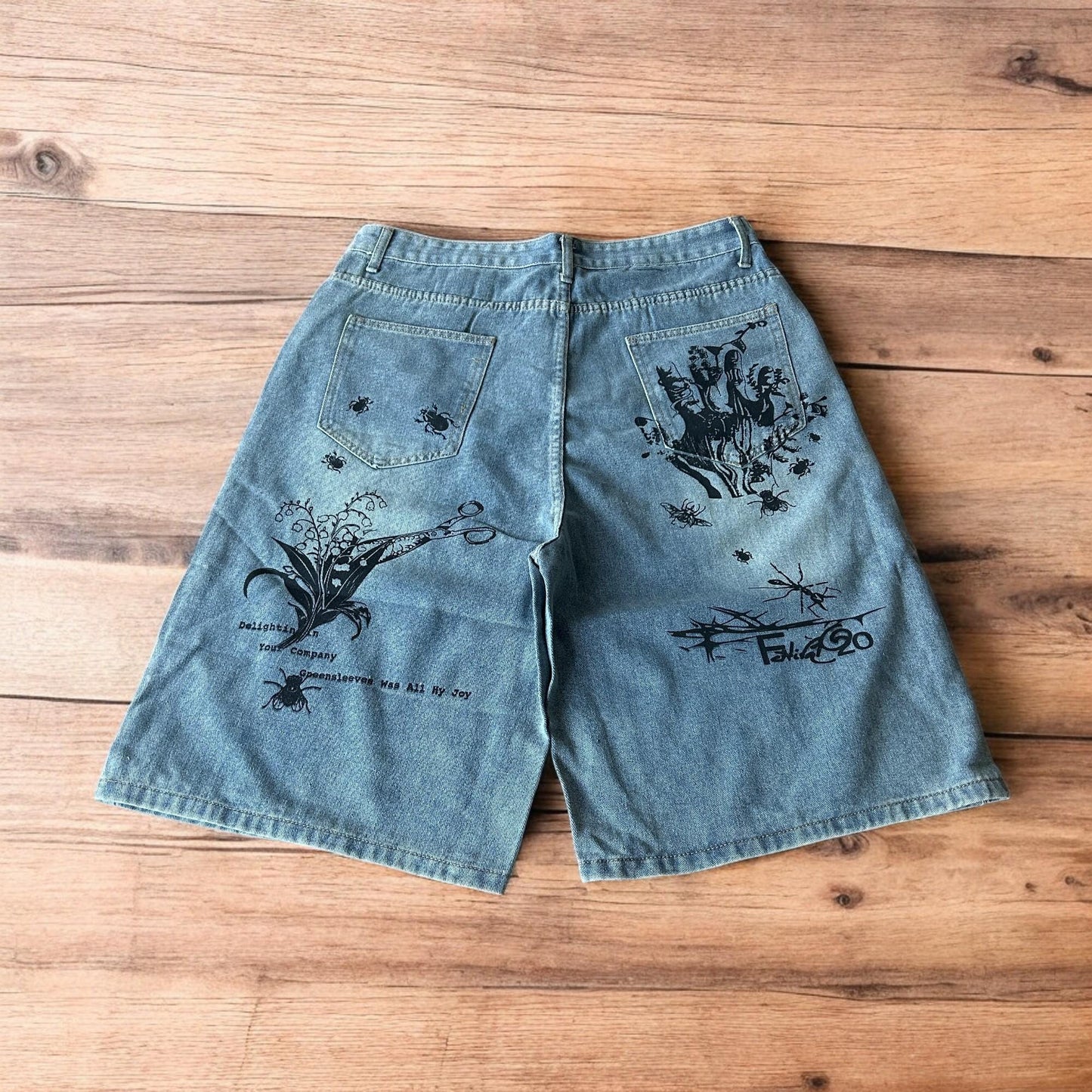 Incredible baggy wide leg denim shorts jorts with graffiti/graphic in light blue.