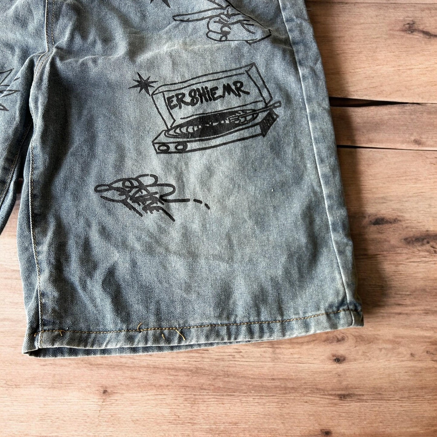 Incredible baggy wide leg denim shorts jorts with graffiti/graphic in light blue.