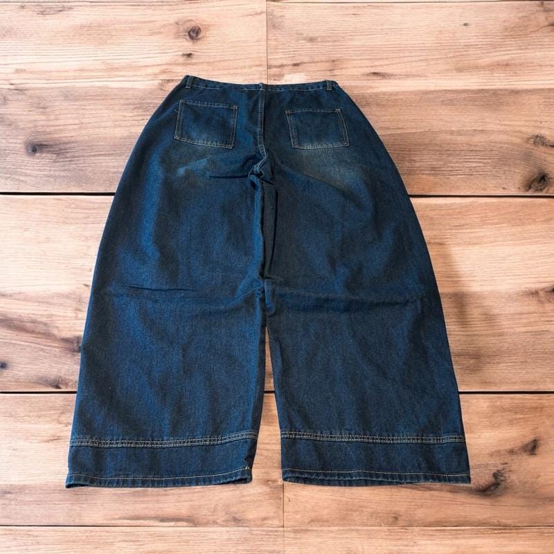 Incredible vintage style baggy wide leg skater fit jeans with fade in dark blue.