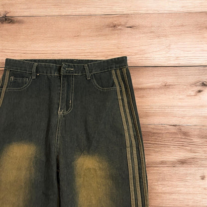 Vintage style relaxed loose skater fit jeans with side stripes in dark blue wash.