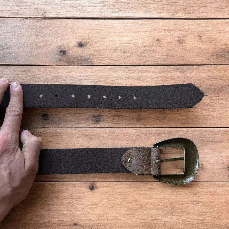 Vintage style faux leather western cowboy gothic belt in brown with brass trim.