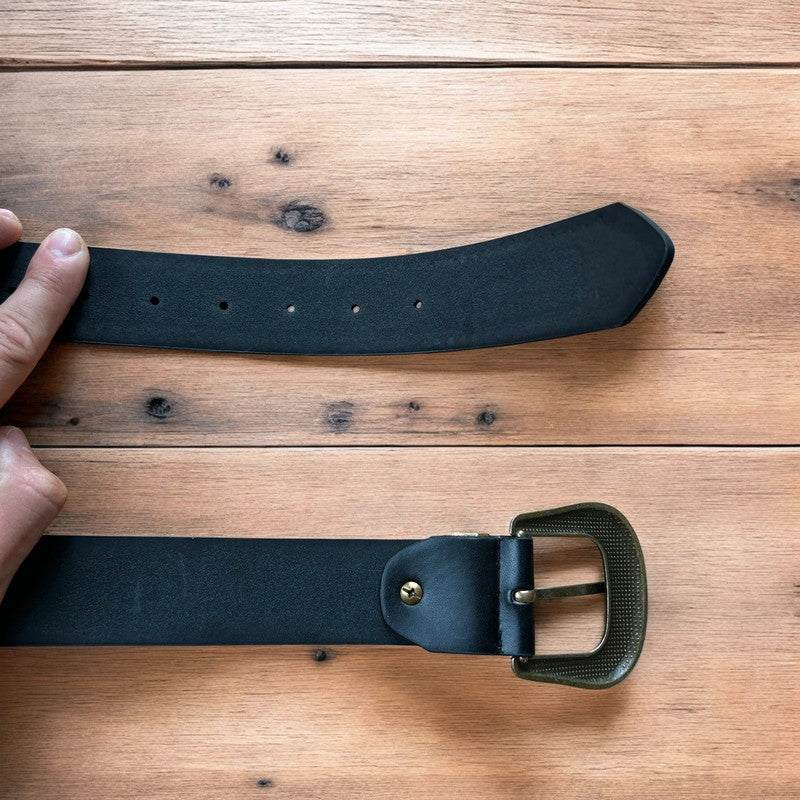 Vintage style faux leather western cowboy gothic belt in black with brass trim.