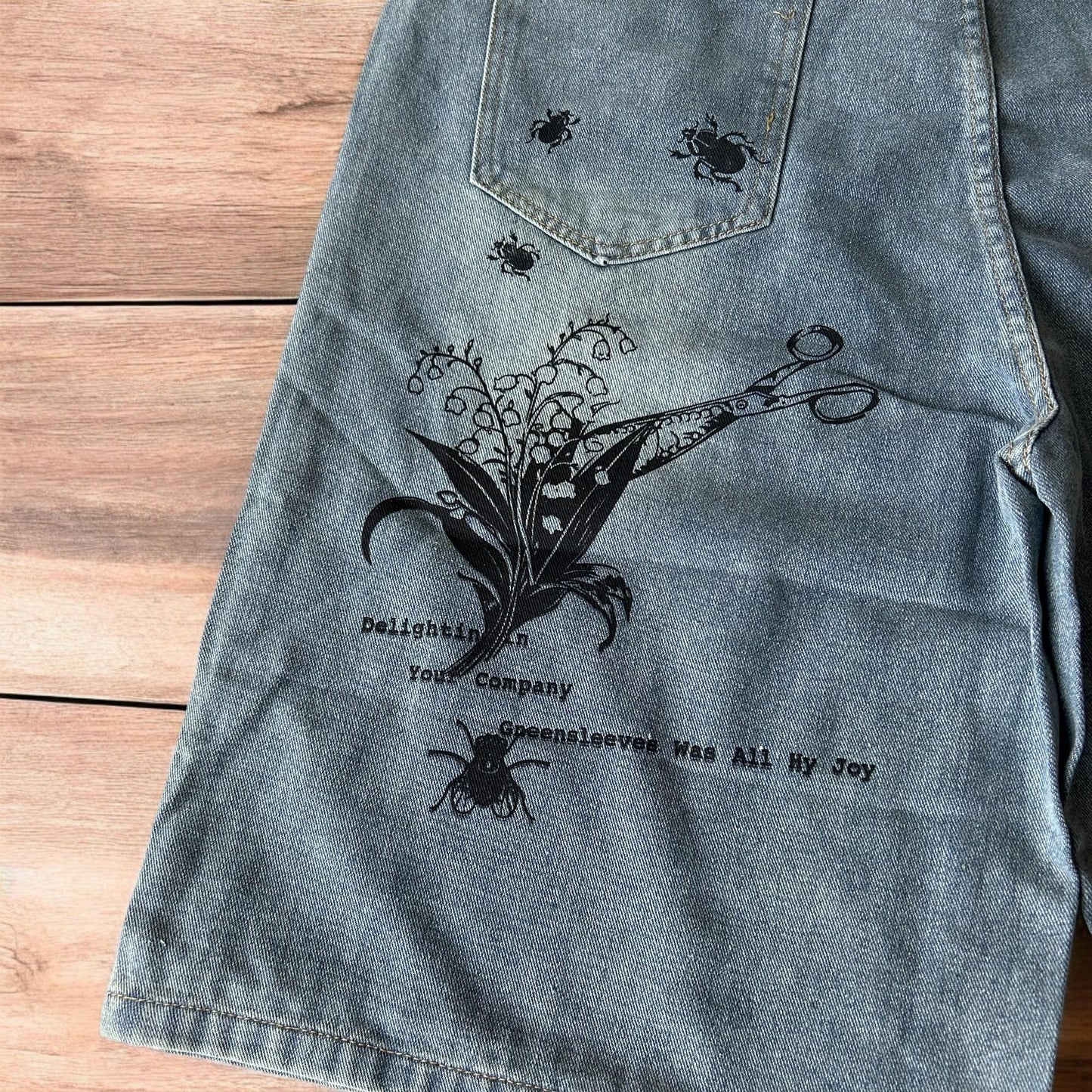 Incredible baggy wide leg denim shorts jorts with graffiti/graphic in light blue.